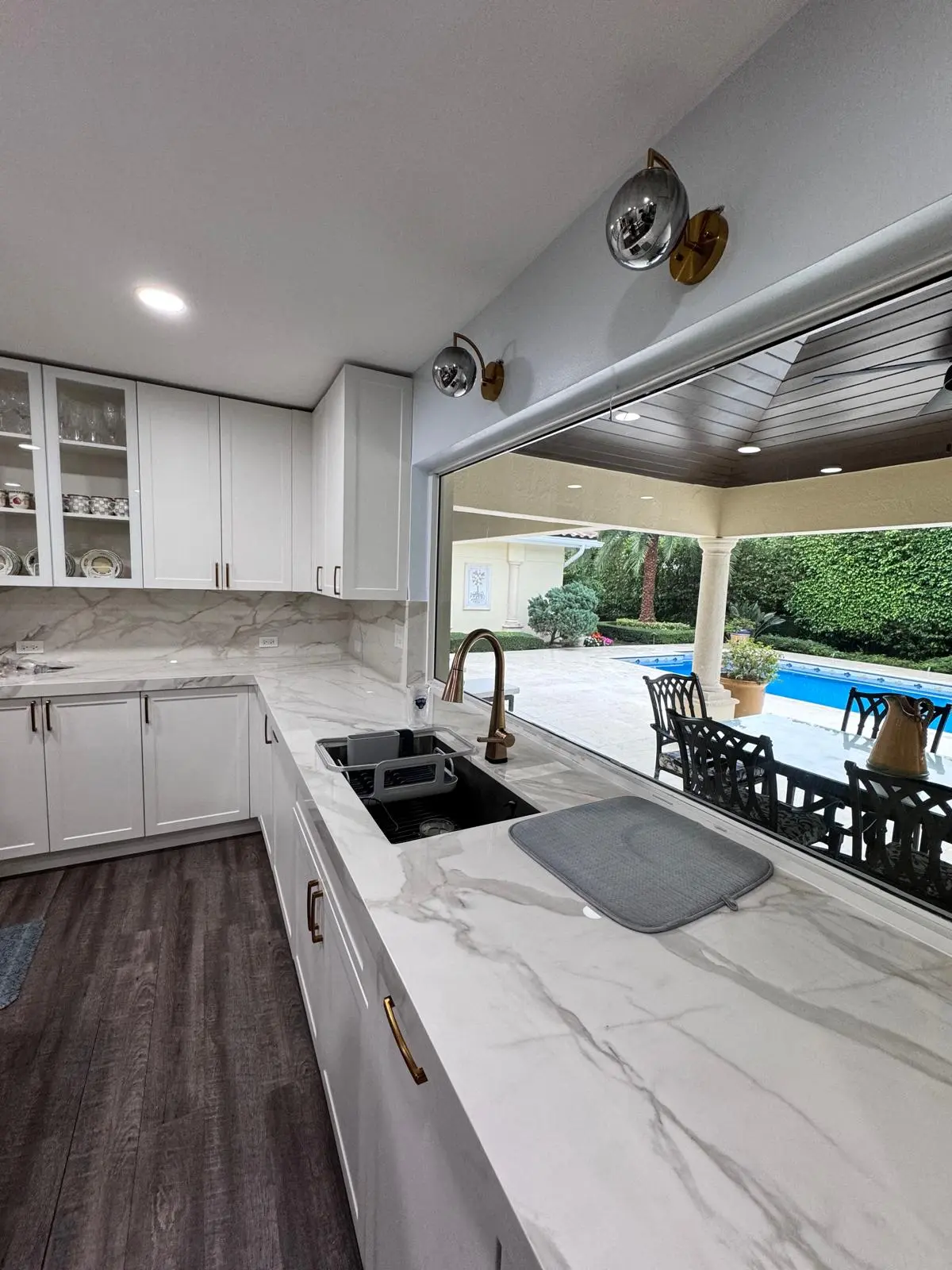 White Shaker kitchen with glass display cabinets