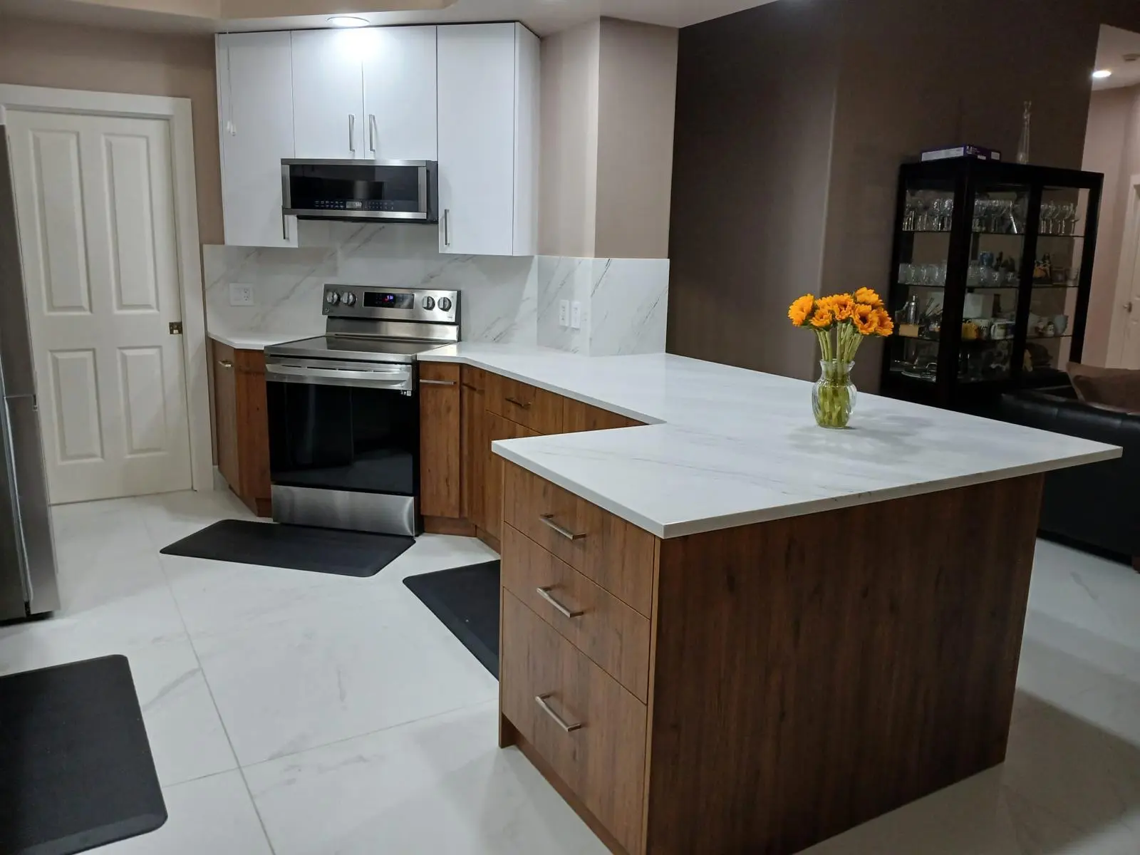 White kitchen with walnut island cabinetry