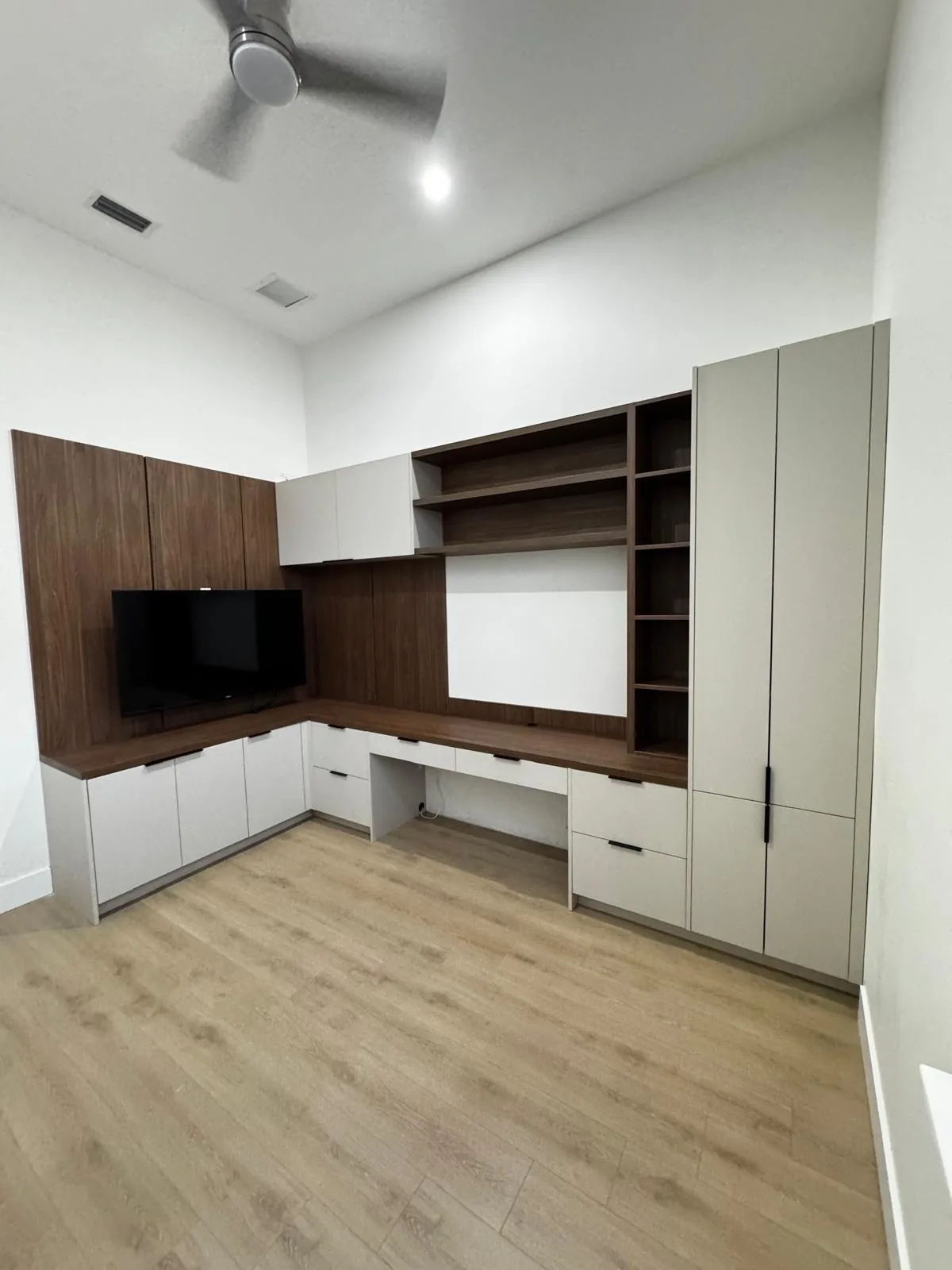 Custom media wall and built-in cabinetry by Decoart